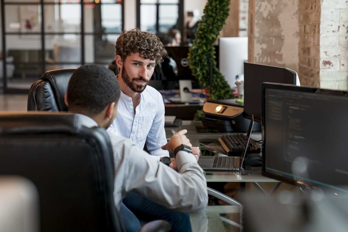 Two St. Louis Web Design Company developers collaborating on a website.